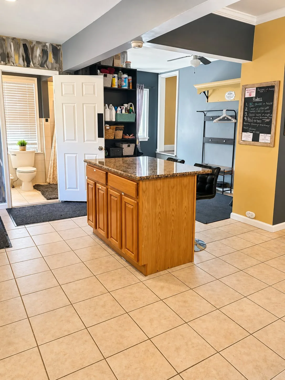The shared kitchen island and pantry shelves